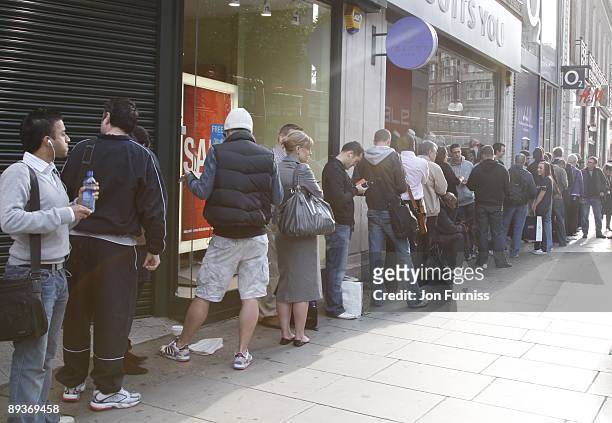 Customers queue to purchase a new iphone 3G at the O2 store in Oxford Street on July 11, 2008 in London, England.