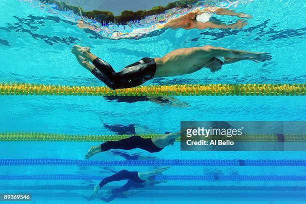 Michael Phelps of the United States competes in the Men's 200m Butterfly Heats during the 13th FINA World Championships at the Stadio del Nuoto on...