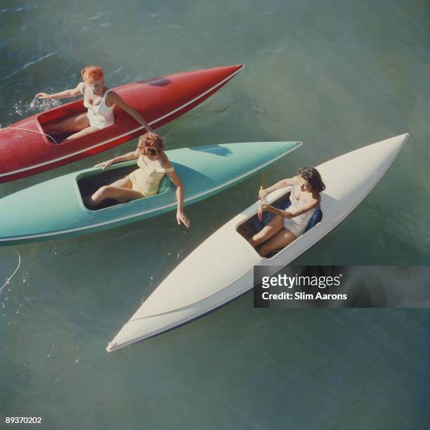 Young women canoeing at Zephyr Cove on the Nevada side of Lake Tahoe, USA, 1959.