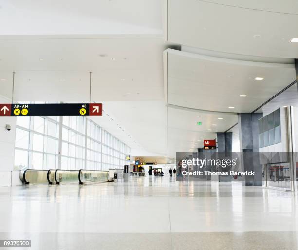 concourse at airport terminal - luchthaventerminal stockfoto's en -beelden
