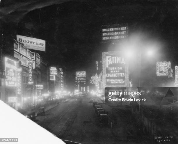 Various neon advertisements in Times Square, New York City, circa 1925. Looking north up Broadway and 7th Avenue from West 46th Street.