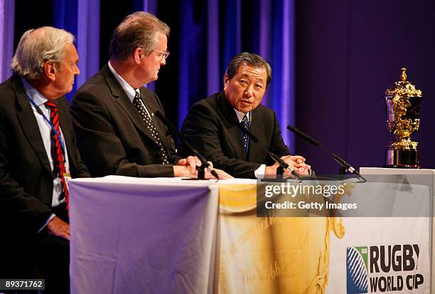 Martyn Thomas of England, Bernard Lapasset , Chairman of the International Rugby Board, and Noboru Mashimo of Japan give their initial reaction after...