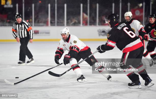 Ottawa Senators alumni Mike Fisher battles for a loose puck with Wade Redden during the 2017 Scotiabank NHL100 Classic Ottawa Senators Alumni Game on...