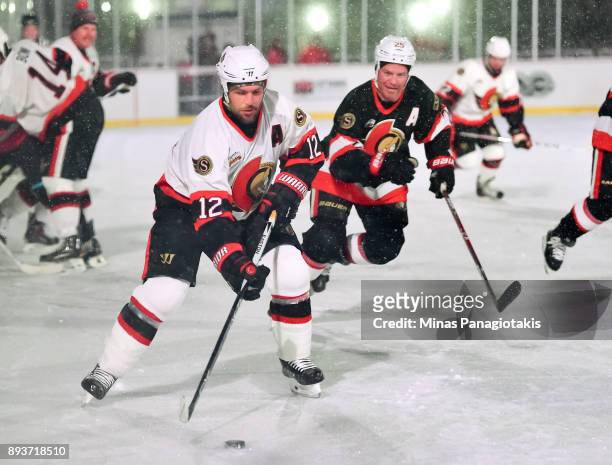 Ottawa Senators alumni Mike Fisher stickhandles the puck with Chris Neil chasing during the 2017 Scotiabank NHL100 Classic Ottawa Senators Alumni...