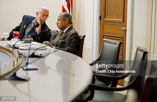 Dr. Patch Adams , founder of the Gesundheit Institute, talks with House Judiciary Committee Chairman John Conyers as he eats breakfast before a...
