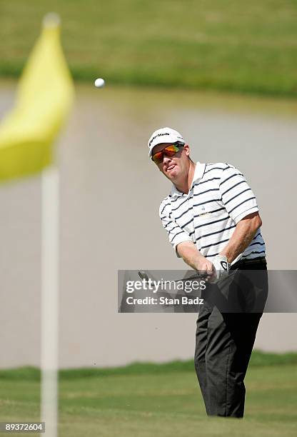 Former champion Tripp Isenhour chips onto the 18th green during Wednesday's Pro-Am of the Movistar Panama Championship held at the Club de Golf de...