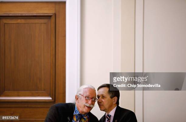 Dr. Patch Adams , founder of the Gesundheit Institute, talks with Rep. Dennis Kucinich during during a health care reform panel discussion with House...