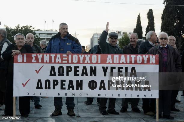 Pensioners hold banner during the protest of pensioners at Syntagma Square. They are protesting to the government of pension cuts and austerity...
