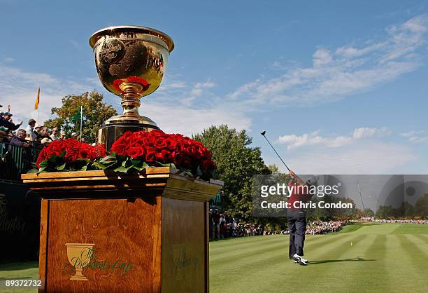 Tiger Woods hits from the first tee during the fifth round of singles competition for The Presidents Cup on September 30 at The Royal Montreal Golf...