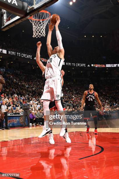 Timofey Mozgov of the Brooklyn Nets dunks against the Toronto Raptors on December 15, 2017 at the Air Canada Centre in Toronto, Ontario, Canada. NOTE...