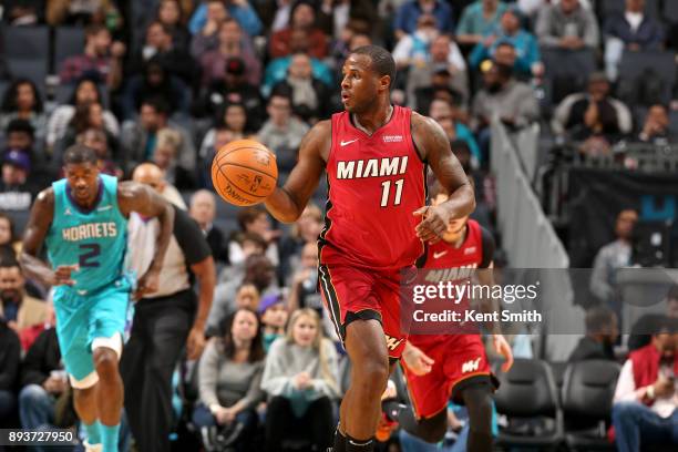 Dion Waiters of the Miami Heat handles the ball against the Charlotte Hornets on December 15, 2017 at Spectrum Center in Charlotte, North Carolina....