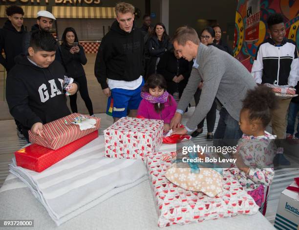 Stu Holden along with Mia Hamm and Dwayne De Rosario hand out gifts during the Kick in for Houston participants and Leesa Sleep surprise familes...