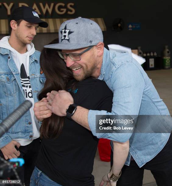 Aric Harding receives gifts durng the Kick in for Houston participants and Leesa Sleep surprise familes affected by Hurricane Harvey with gifts at...