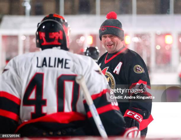 Ottawa Senators alumni Chris Phillips talks with Patrick Lalime during the 2017 Scotiabank NHL100 Classic Ottawa Senators Alumni Game on Parliament...