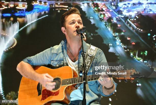 Singer/songwriter Lucas Hoge performs during the "Outside the Barrel" with Flint Rasmussen show during the National Finals Rodeo's Cowboy Christmas...
