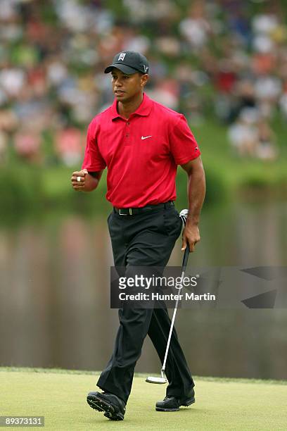 Tiger Woods reacts to his shot during the final round of the AT&T National hosted by Tiger Woods at Congressional Country Club on July 5, 2009 in...