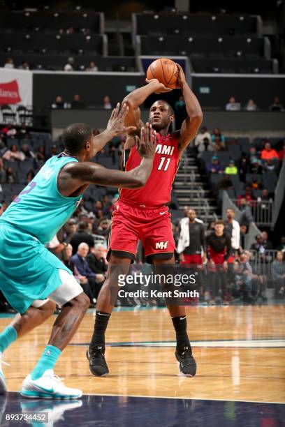 Dion Waiters of the Miami Heat shoots the ball against the Charlotte Hornets on December 15, 2017 at Spectrum Center in Charlotte, North Carolina....