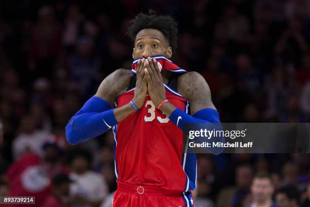 Robert Covington of the Philadelphia 76ers reacts in the first overtime against the Oklahoma City Thunder at the Wells Fargo Center on December 15,...