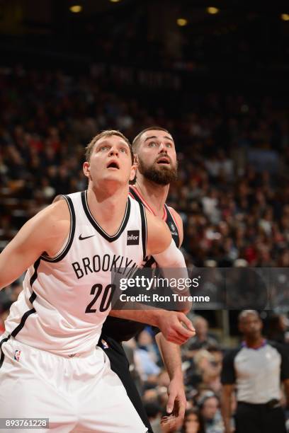 Timofey Mozgov of the Brooklyn Nets plays defense against Jonas Valanciunas of the Toronto Raptors on December 15, 2017 at the Air Canada Centre in...