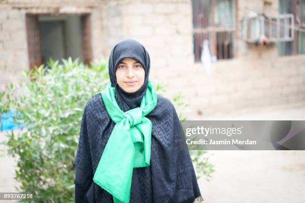 muslim woman portrait on street - shiite islam stock-fotos und bilder