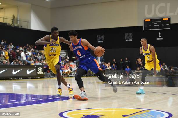 Isaiah Hicks of the Westchester Knicks handles the ball against Thomas Bryant of the South Bay Lakers during an NBA G-League game on December 15,...