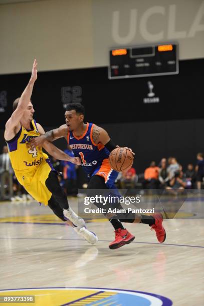 Xavier Rathan-Mayes of the Westchester Knicks handles the ball against Alex Caruso of the South Bay Lakers during an NBA G-League game on December...