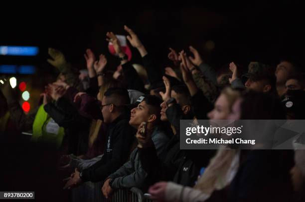 Attendees watch a musical performance during Base*FEST Powered by USAA on December 15, 2017 at Naval Air Station Pensacola, Florida.