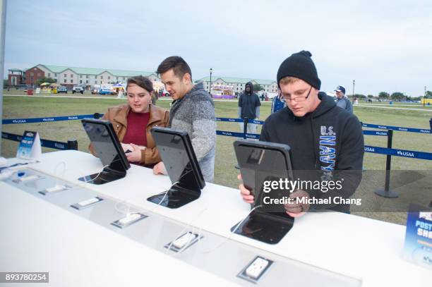 Attendees register to compete in the USAA Next Level Challenge during Base*FEST Powered by USAA on December 15, 2017 at Naval Air Station Pensacola,...