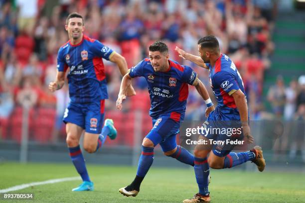 Dimitri Petratos of the Jets celebrates with team mates after scoring a goal during the round 11 A-League match between the Newcastle Jets and the...