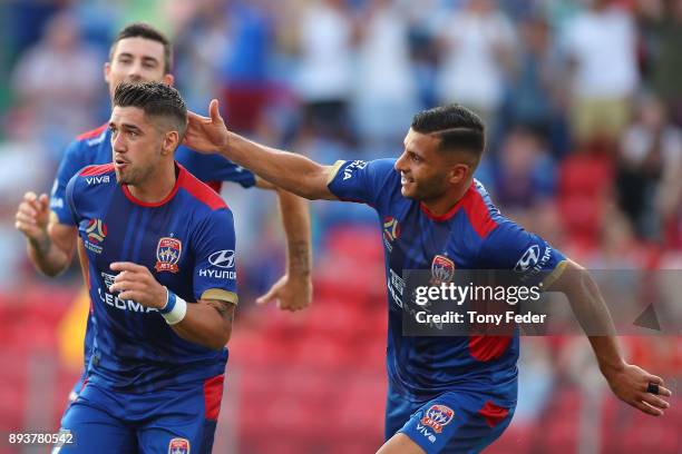 Dimitri Petratos of the Jets celebrates with team mates after scoring a goal during the round 11 A-League match between the Newcastle Jets and the...