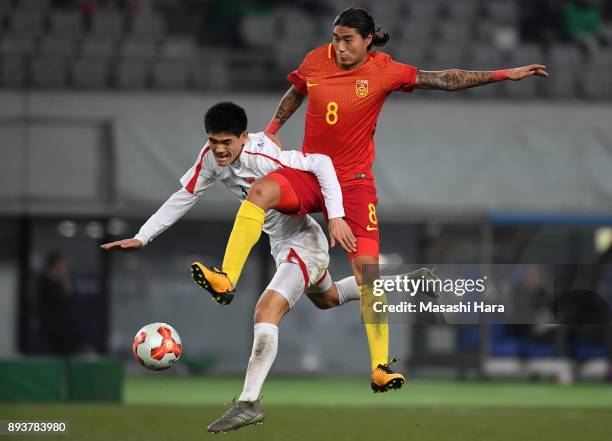 Ri Un Chol of North Korea and Zhao Yuhao of China compete for the ball during the EAFF E-1 Men's Football Championship between China and North Korea...