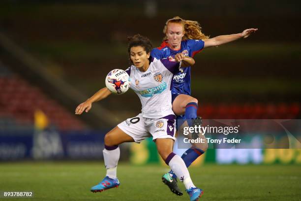 Raquel Rodriguez of the Glory and Victoria Huster of the Jets contest the ball during the round eight W-League match between the Newcastle Jets and...