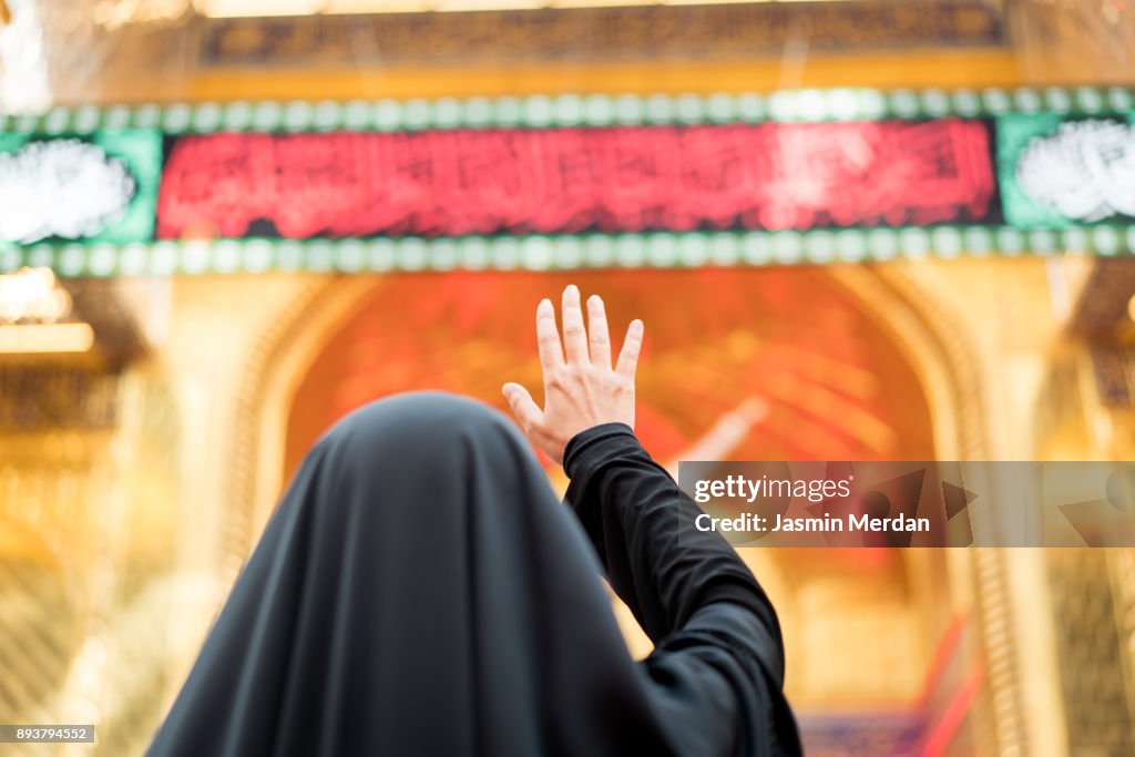 Woman Praying Inside A Mosque