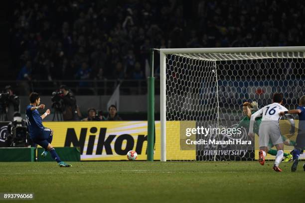 Yu Kobayashi of Japan converts the penalty to score the opening goal during the EAFF E-1 Men's Football Championship between Japan and South Korea at...