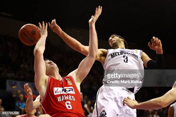 Ogilvy of the Hawks and Josh Boone of Melbourne United compete for the ball during the round 10 NBL match between the Illawarra Hawks and the...