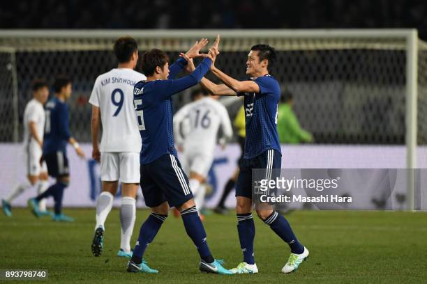 Naomichi Ueda and Genta Miura of Japan celebrate after awarded a penalty kick during the EAFF E-1 Men's Football Championship between Japan and South...