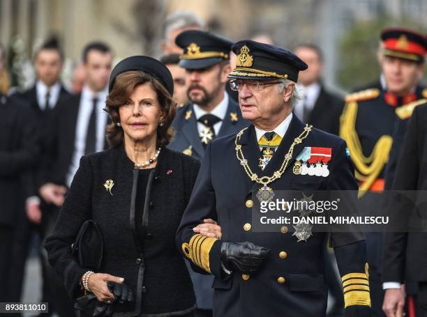 King Carl XVI Gustaf of Sweden and Queen Silvia of Sweden attend the funeral ceremony for the late King Michael I of Romania inside the former Royal...