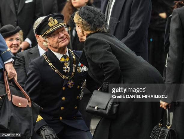 King Carl XVI Gustaf of Sweden is embraced by Queen Anne-Marie of Greece at the funeral ceremony for the late King Michael I of Romania inside the...