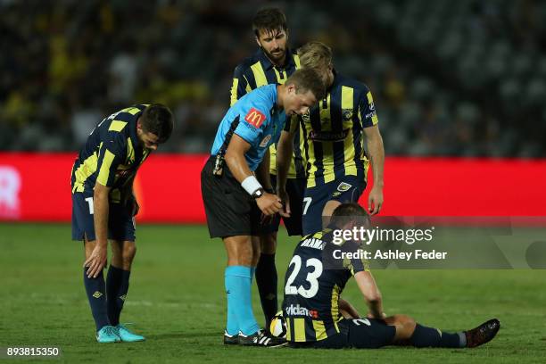 Referee Alex King checks on Wout Brama of the Mariners during the round 11 A-League match between the Central Coast and the Western Sydney Wanderers...