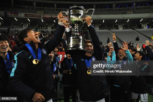South Korean players celebrate the East Asian Champions in front of their supporters following their 4-1 victory in the EAFF E-1 Men's Football...