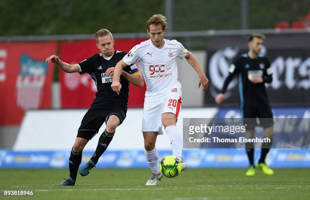 Rene Lange of Zwickau is challenged by Dennis Grote of Chemnitz during the 3. Liga match between FSV Zwickau and Chemnitzer FC at Stadion Zwickau on...