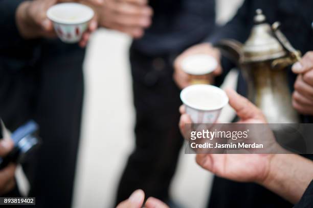 having traditional arabian coffee with friends - bahrain stock-fotos und bilder