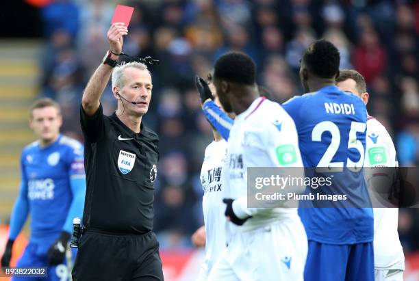 Referee Martin Atkinson shows a red card to Wilfred Ndidi of Leicester City during the Premier League match between Leicester City and Crystal Palace...
