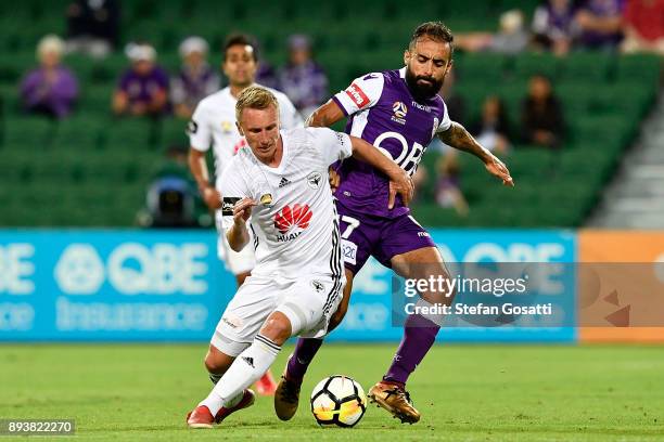 Goran Paracki of the Phoenix contests the ball against Diego Castro of the Glory during the round 11 A-League match between the Perth Glory and the...