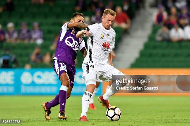 Goran Paracki of the Phoenix contests the ball against Diego Castro of the Glory during the round 11 A-League match between the Perth Glory and the...