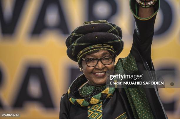 The former wife of the late South African President Nelson Mandela, anti-apartheid campaigner Winnie Mandela waves as she attends the 54th ANC...