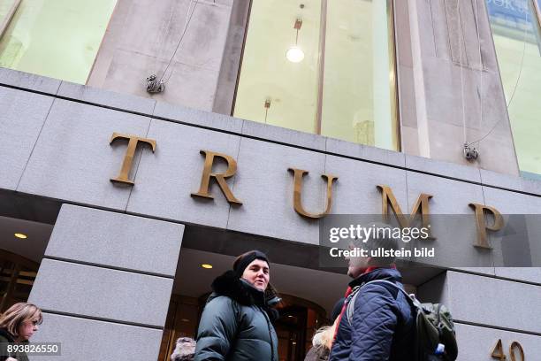 January 20th New York, NY, USA. A view of the Trump building near the New York Stock Exchange in Wall street. With the 2017 presidential campaign in...