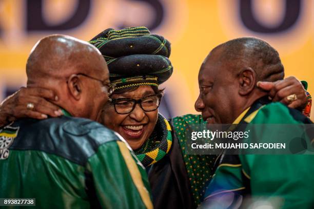 The former wife of the late South African President Nelson Mandela, anti-apartheid campaigner Winnie Mandela , hugs South African President Jacob...