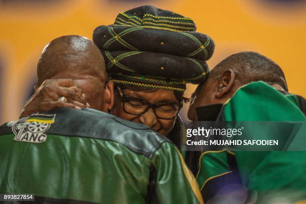 The former wife of the late South African President Nelson Mandela, anti-apartheid campaigner Winnie Mandela , hugs South African President Jacob...