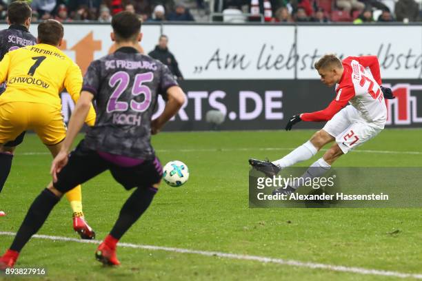Alfred Finnbogason of Augsburg scores the opening gaol during the Bundesliga match between FC Augsburg and Sport-Club Freiburg at WWK-Arena on...